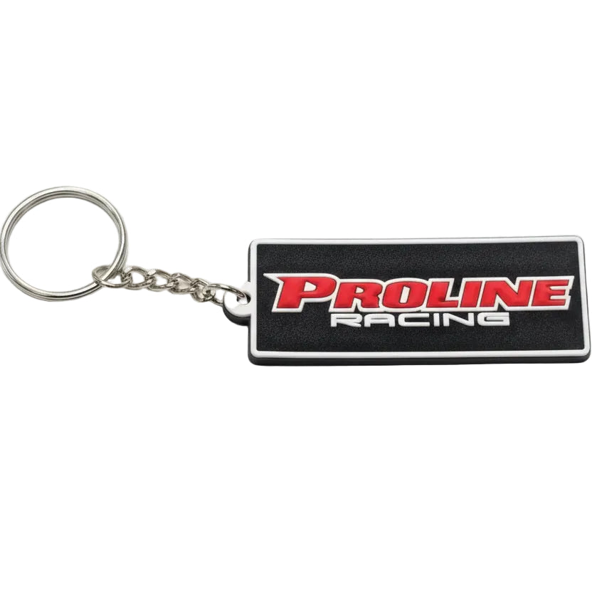 A PVC keychain with a rectangular black and white PROLINE RACING logo, attached to a metal keyring.