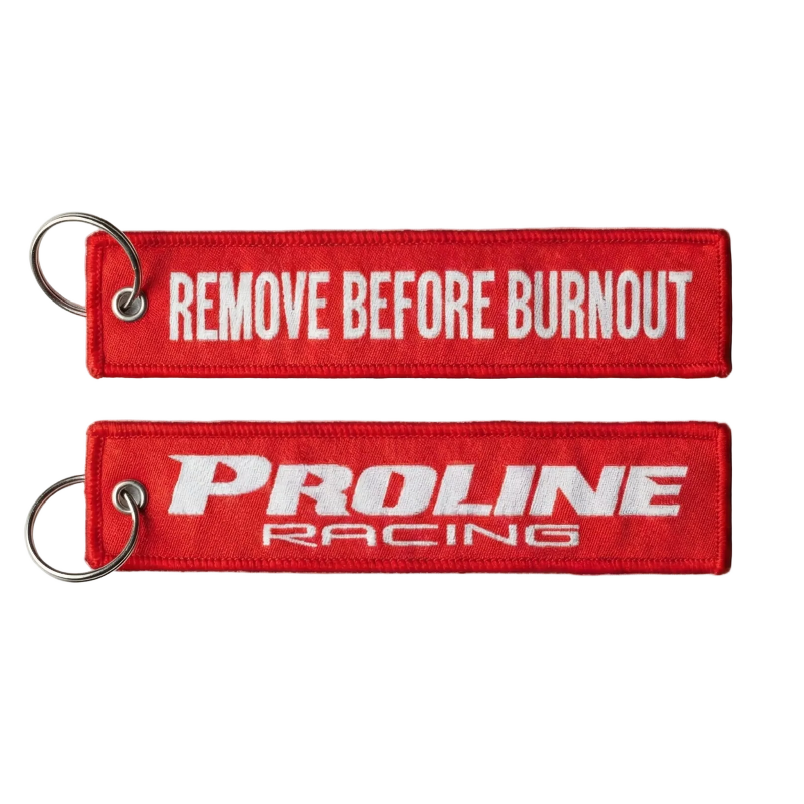 Two red keychains with 'Proline Racing' and 'Remove Before Burnout' text on a white background.